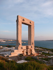 The ancient stone gate (Portara or the Temple of Apollo) on the Naxos Island, Greece 