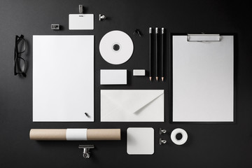 Photo of blank stationery set on black background. Corporate identity mock up for placing your...