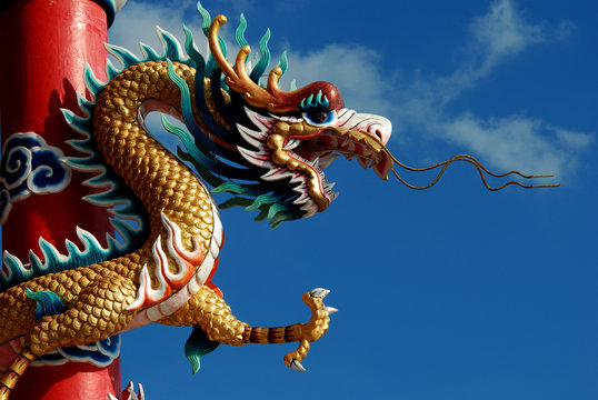 Chinese dragon in front of blue sky.