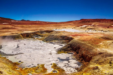 View on mud pool by geyser Sol de la Manana in the Altiplano of Bolivia