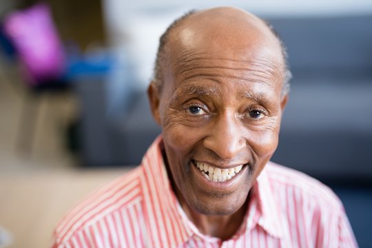 Portrait of smiling senior man with receding hairline