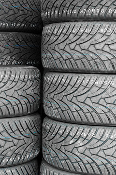 Car tires in shelf tire storehouse at sale at a tire store.