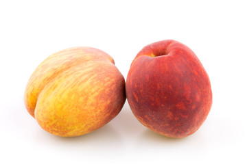 Red and yellow peaches isolated  on white background in studio