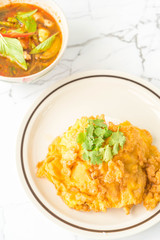 Thai spicy chicken soup  with omelet and rice