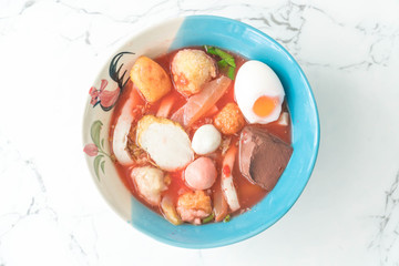 Thai-style noodle soup with fishballs and homemade red sauce