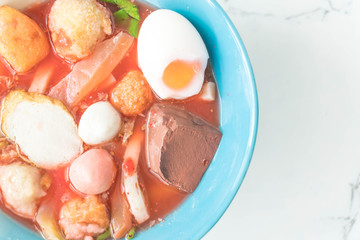 Thai-style noodle soup with fishballs and homemade red sauce