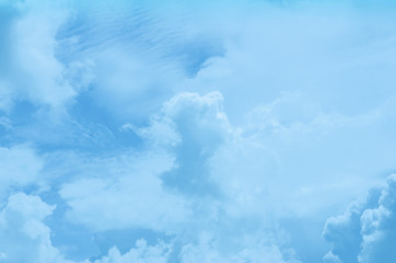Blue sky background with white clouds.