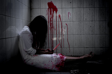 Ghost woman or zombie holding knife for kill yourself with blood violence in house of ruin,...