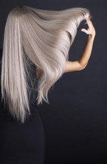 Long straight blonde hair in motion