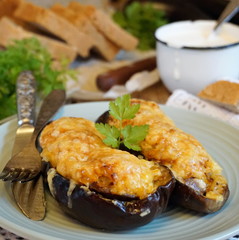 Stuffed eggplants with meat, rice, carrots and cheese