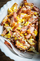 Pieces of sausage fried with egg.