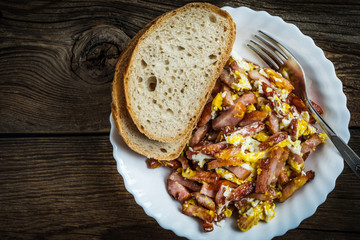 Pieces of sausage fried with egg.