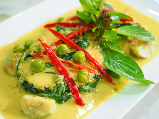Thai local traditional homemade fusion food: Grilled fried sliced cut salmon, thick spicy green curry, coconut milk, 
