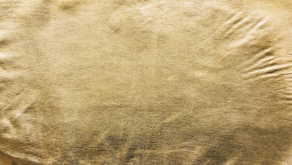 The texture of the gold. Golden material, surface, background. Close-up