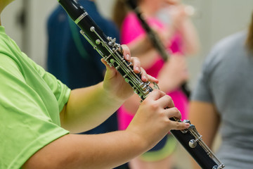 Fototapeta premium hands of a musician playing a clarinet