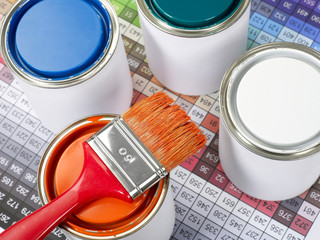 Paint cans, paint brush and color swatch