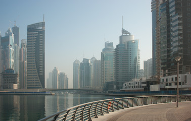 Naklejka premium Modern city on the bay in the morning mist