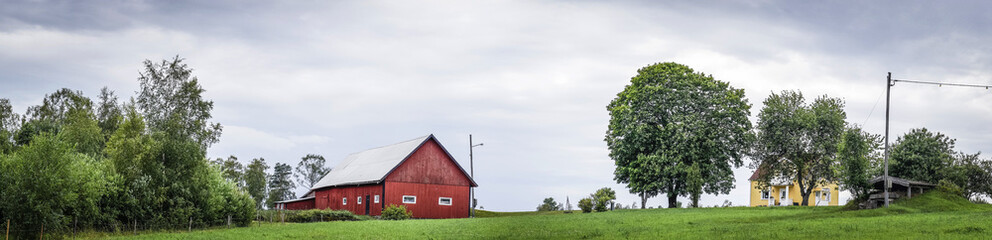 Classic red barn on a green field