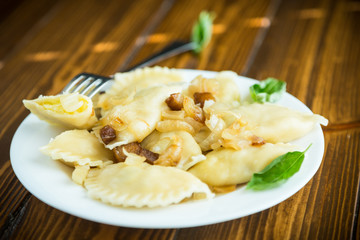 boiled dumplings with potatoes and fried onions