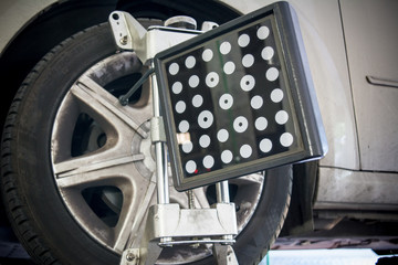 detail of wheel alignment machine tool mounted on a wheel