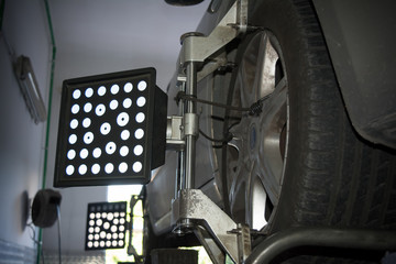 detail of wheel alignment machine tool mounted on a wheel