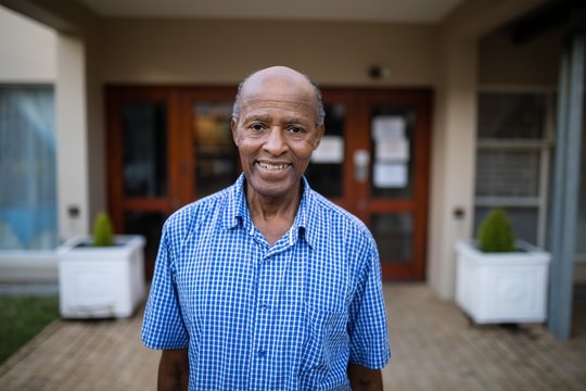 Portrait Of Smiling Senior Man At Nursing Home