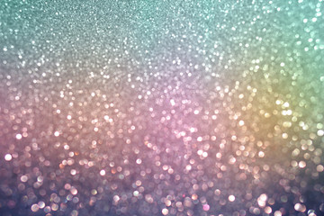 colorful green pink purple and blue bokeh light glitter soft tone background for Christmas and New...