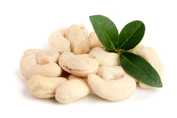 cashew nuts with leaf isolated on white background. macro