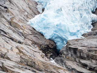 Briksdal Glacier close-up with surrounding rocks, Oldedalen, Norway