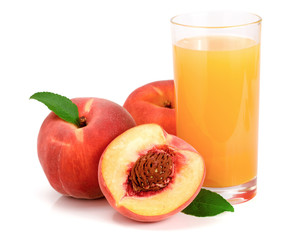 Glass of fruit juice and cut peaches isolated on white background