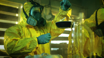 In the Underground Drug Laboratory Team of Clandestine Chemists Synthesises Illegal Drugs, One...