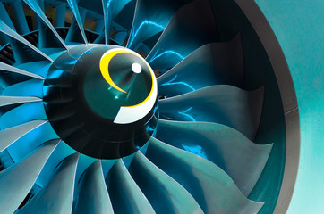 Airplane engine and blades with blue backlight Illumination close up.