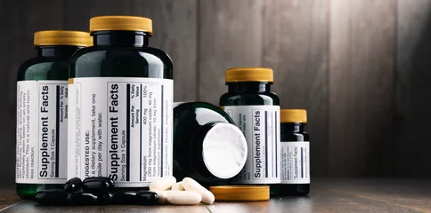 Foto op Canvas Composition with dietary supplement containers. Drug pills © monticellllo