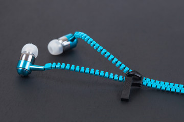 blue earphone and cable line like zipper