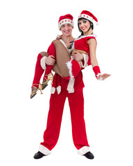 Obraz premium Happy young couple wearing santa claus clothes