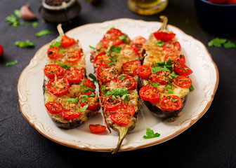 Baked eggplants with mozzarella and tomatoes with Italian herbs