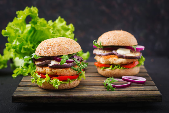 Sandwich juicy spicy chicken burgers with tomato and eggplant