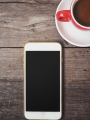 Smart phone with coffee cup