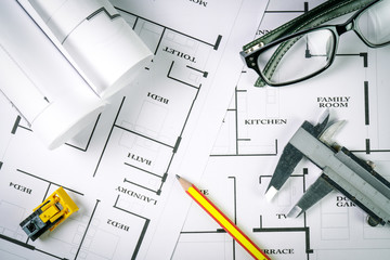 Top view of architect drawing on non identified architectural project with various of tools such as...