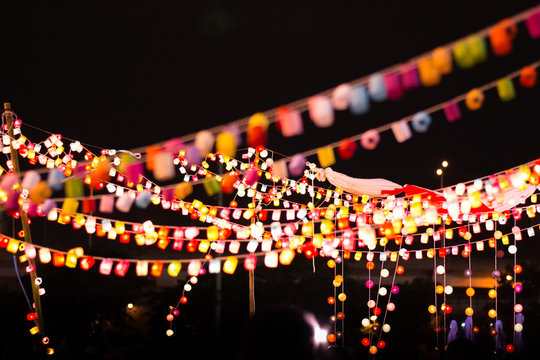 Abstract blurred of image of Bokeh light on night market.