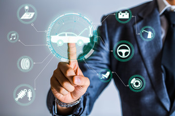 Businessman is checking a hologram to list about the secure of car, Safety drive background. checking concept about oil, vehicle, break, battery, dis-break, streering wheel, shock up, navigator.