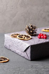 Christmas gifts, new year, holiday, bow, boxes, spruce branches, decorations, selective focus, vertical