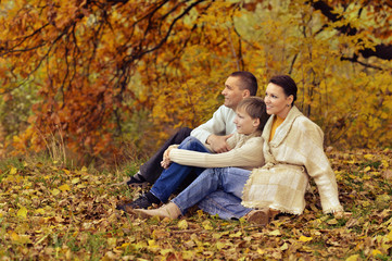 Happy family in the autumn park