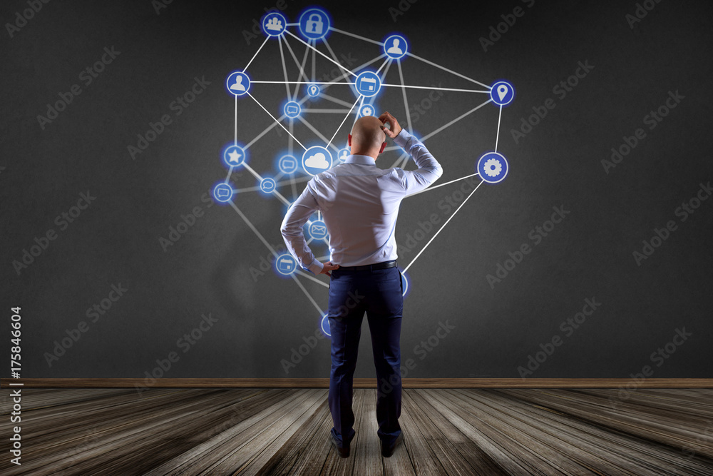 Aufkleber businessman in front of a wall with a business network connection displayed on a futuristic interfac