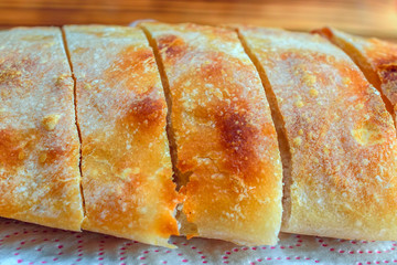sliced homemade bread on a wooden background