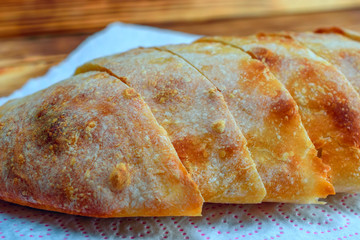 sliced homemade bread on a wooden background