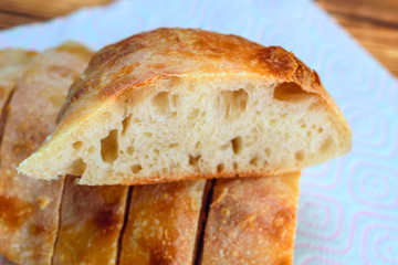 sliced homemade bread on a wooden background