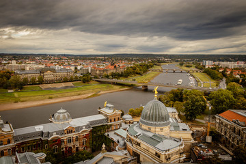 Fototapeta na wymiar City view of Dresden in east Germany on a stormy autumn October day with the Albertinum in the foreground, the Elbe in the middle and Neu Dresden in the background.