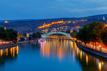 Fototapeta na wymiar Tbilisi. Bridge of peace at sunset.
