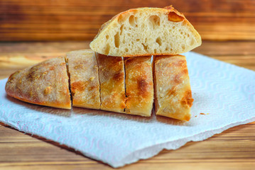 sliced homemade bread on a wooden background